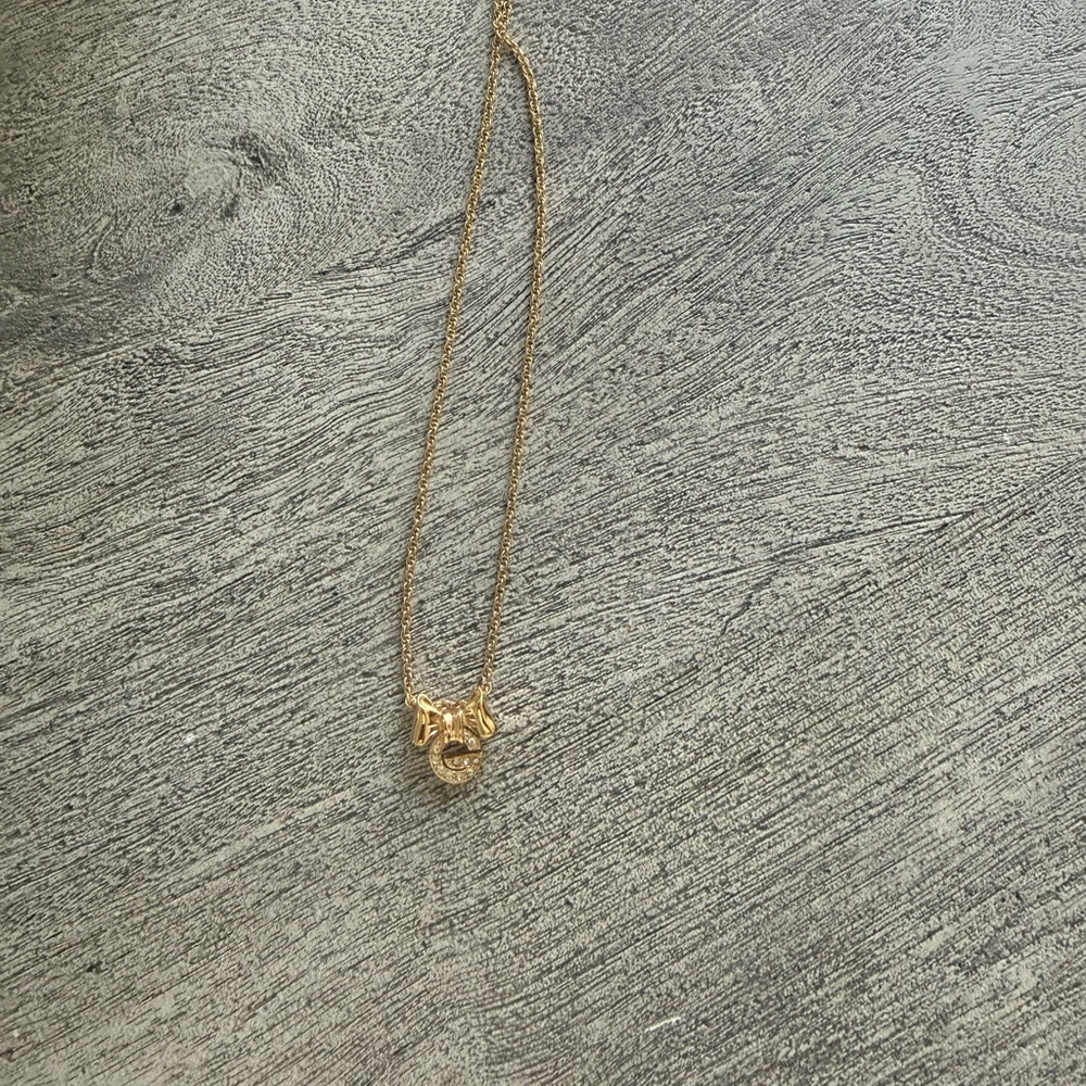 Givenchy “G” Pendant Necklace. Bow rhinestone designer piece. Perfect condition.